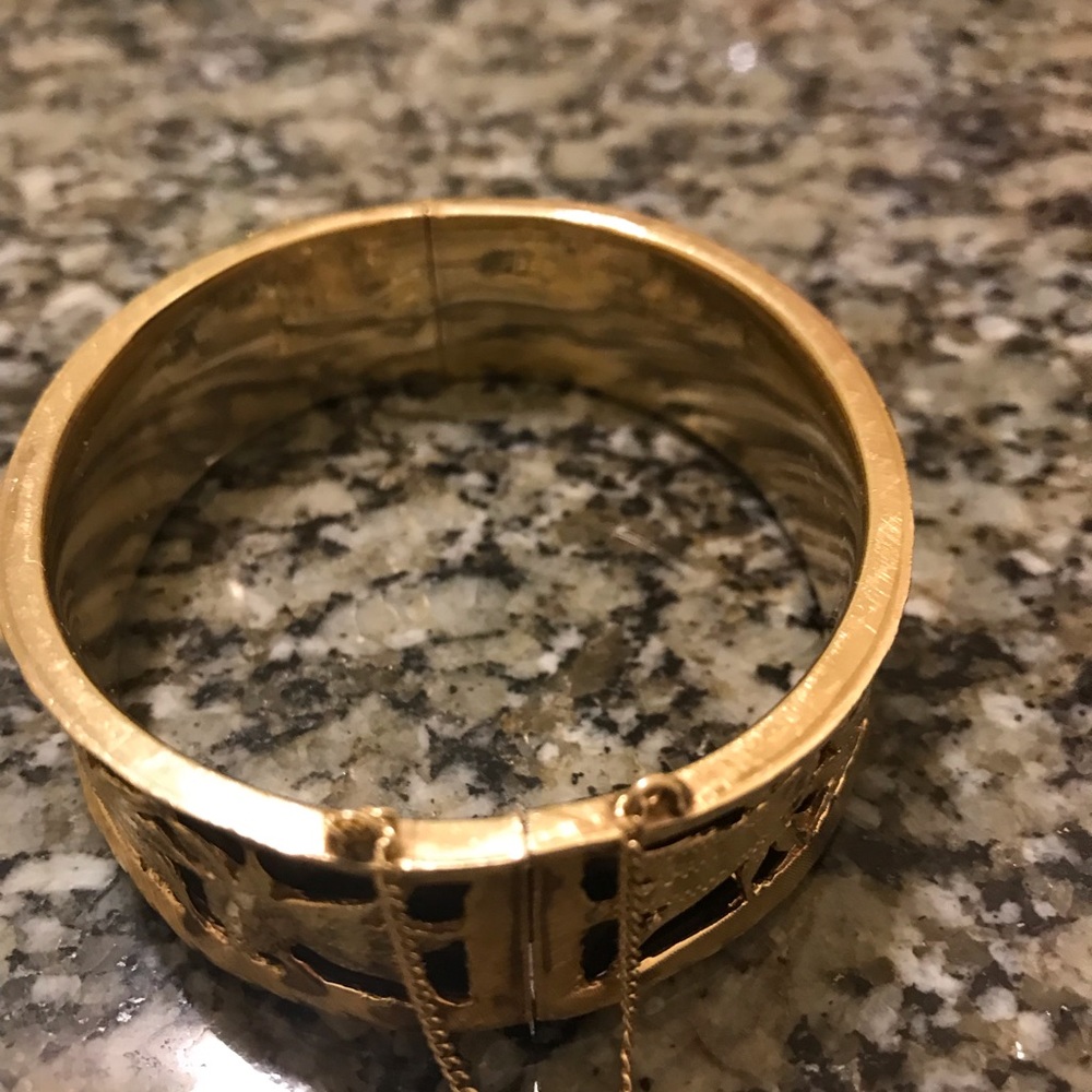 14 it gold bangle solid with black background